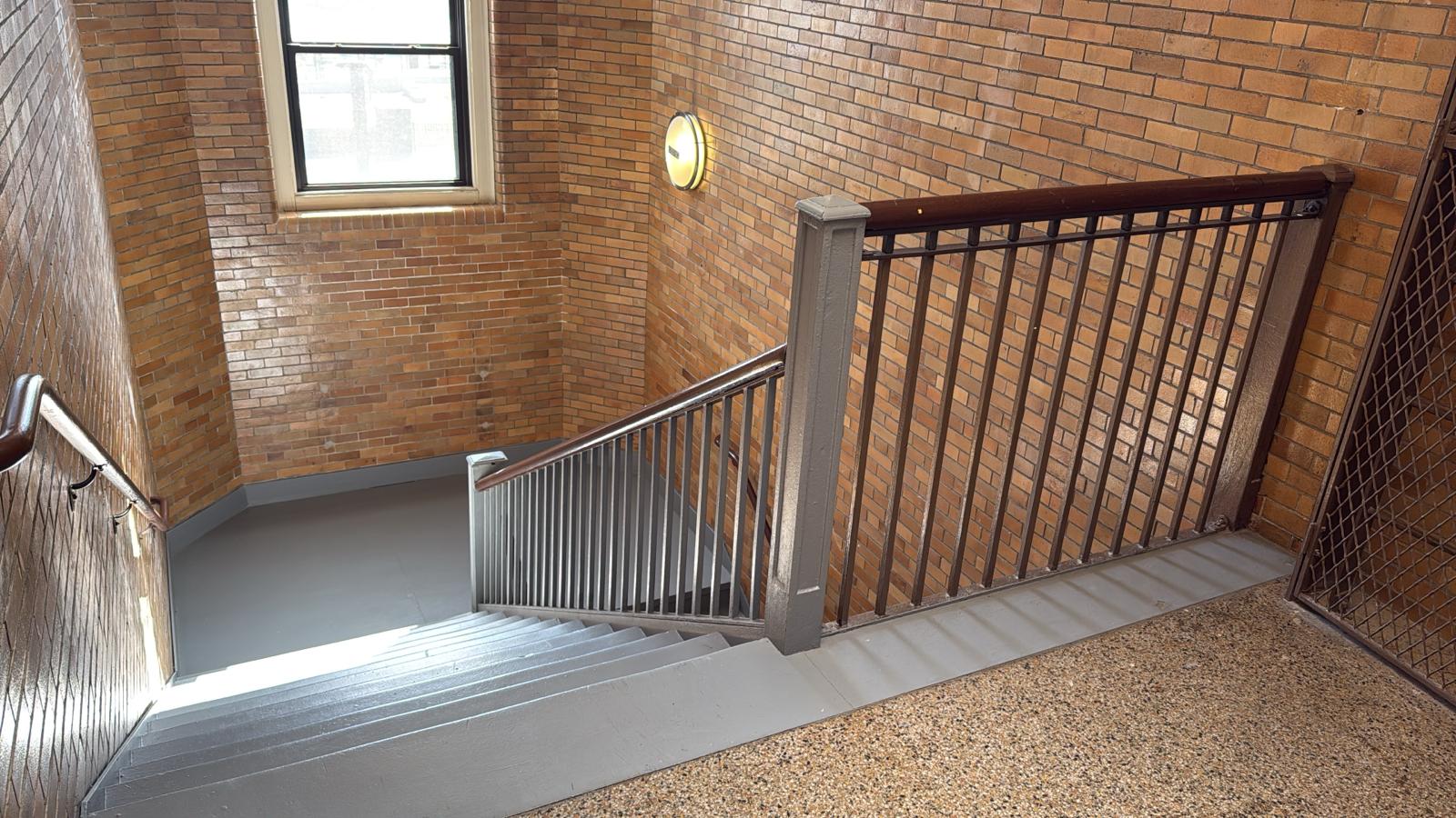 Clean stairwell with exposed brick